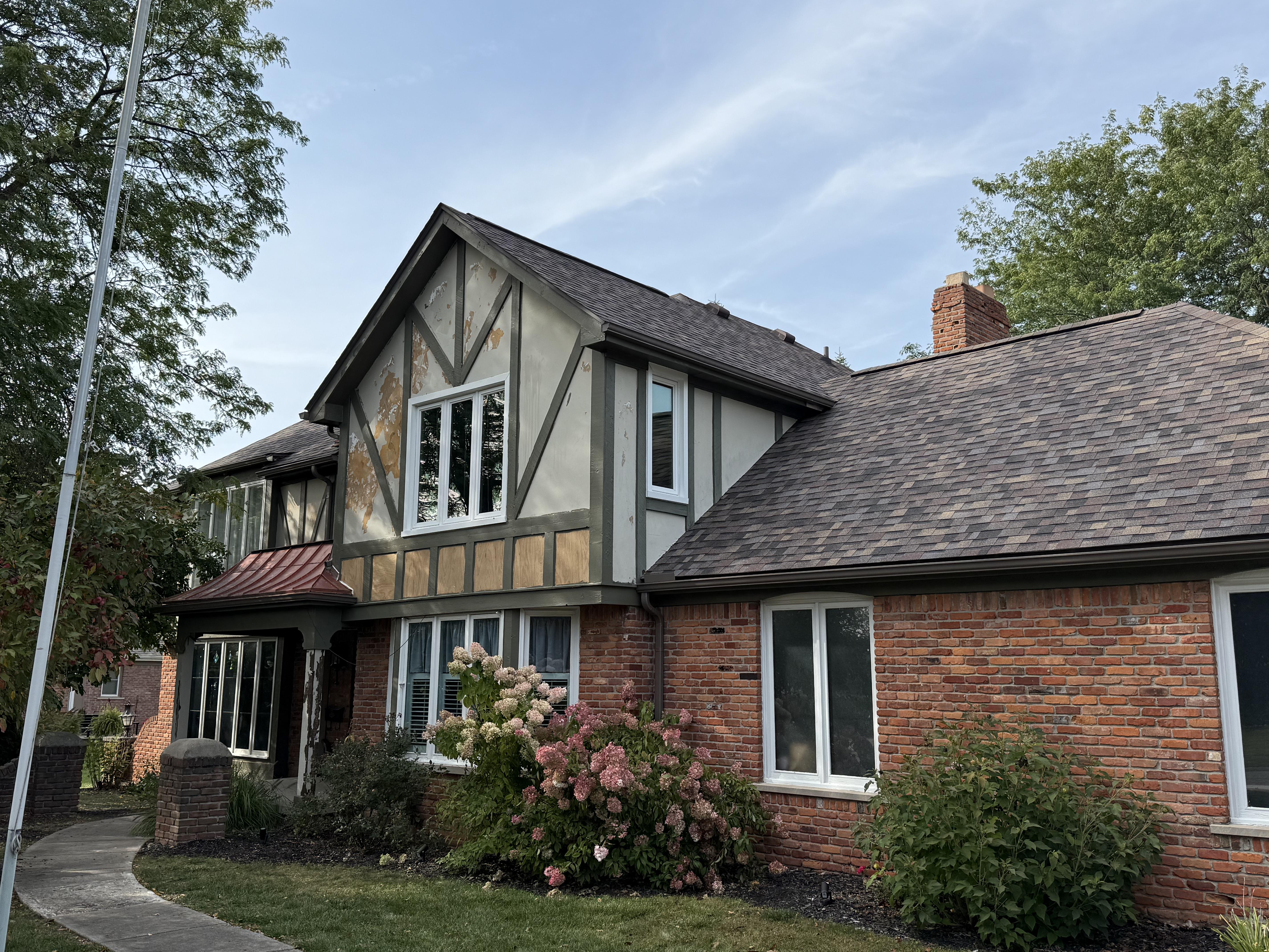 Professional painter working on exterior trim